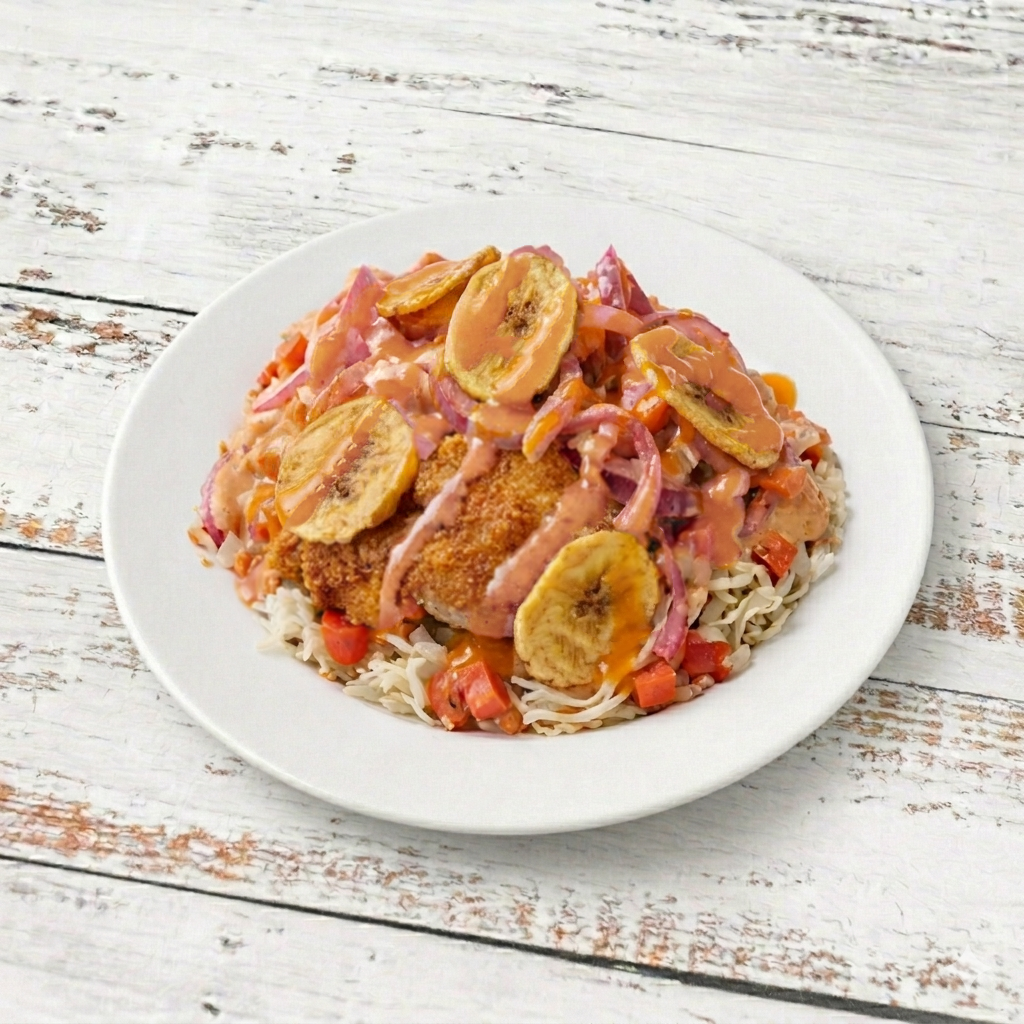Chuleta Con Tajadas/Pork chops with green bananas.