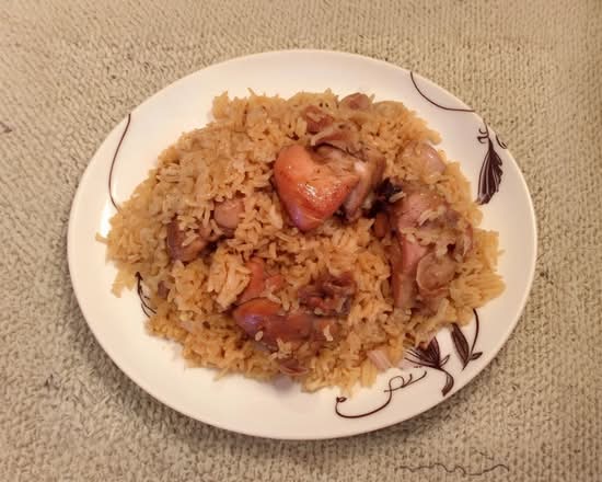 Locrio De Cerdo O Pollo / Mixed Rice with Pork or Chicken.