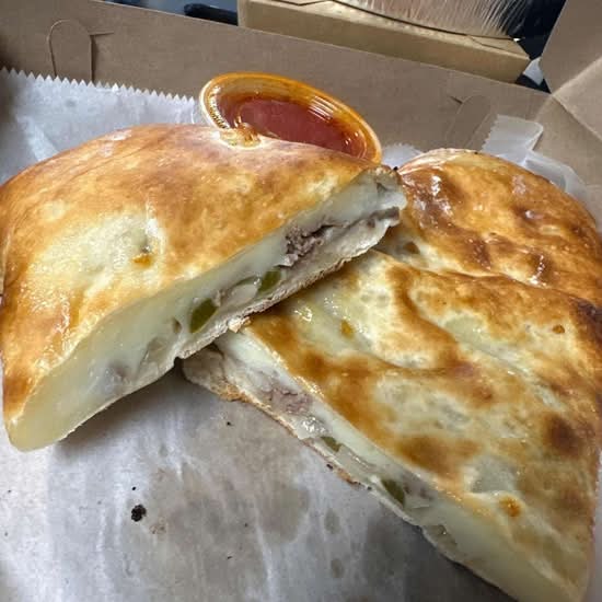 Large Ribeye Steak with Onions & Peppers Stromboli.